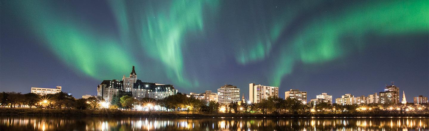 Green Aurora Borealis shimmering over the Chateau Frontenac at night