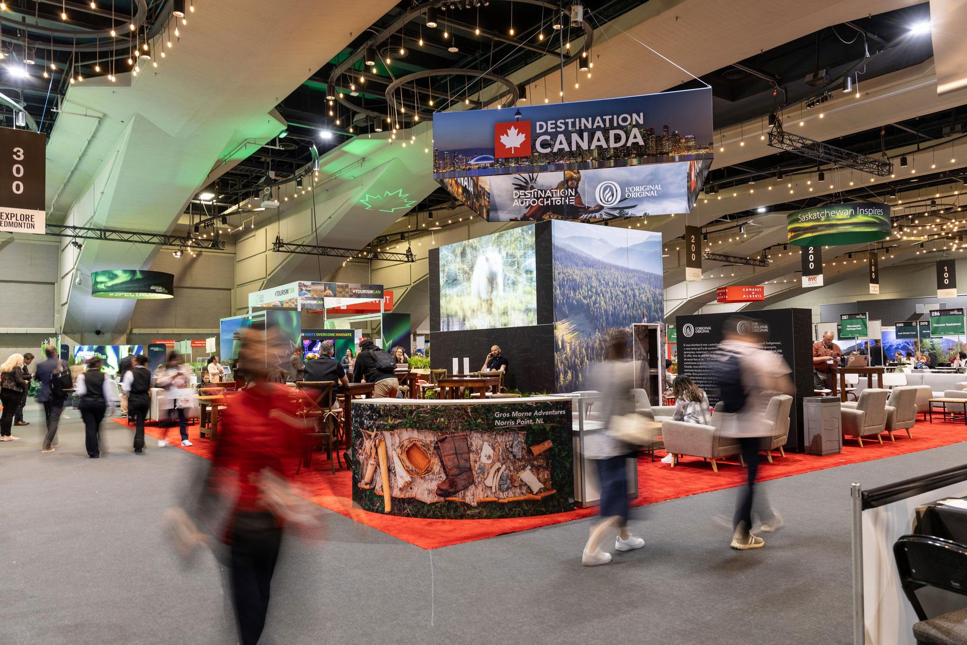 People walk in a blur around a Destination Canada convention.