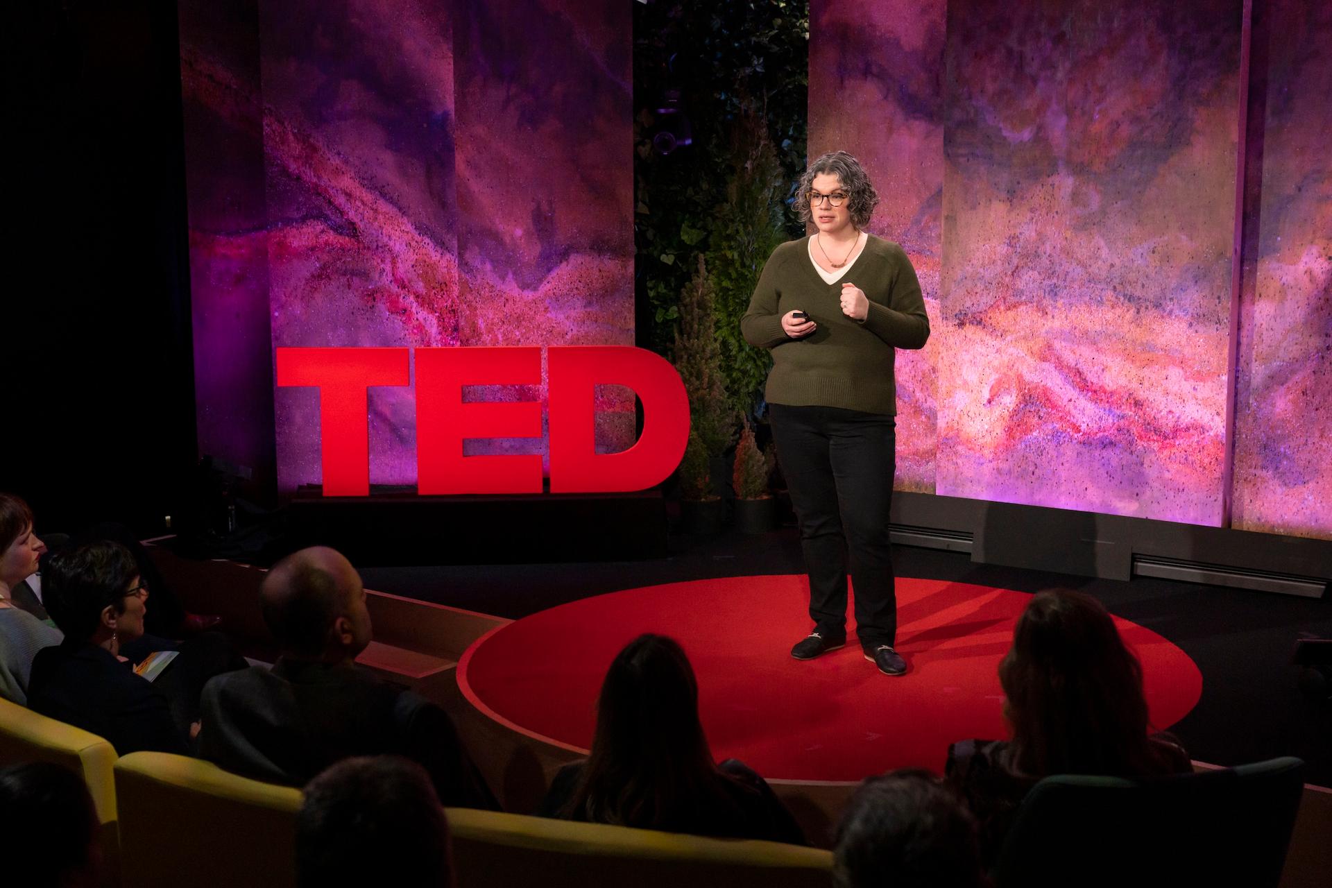 Alona Fyshe gives a TED talk on the TED stage.