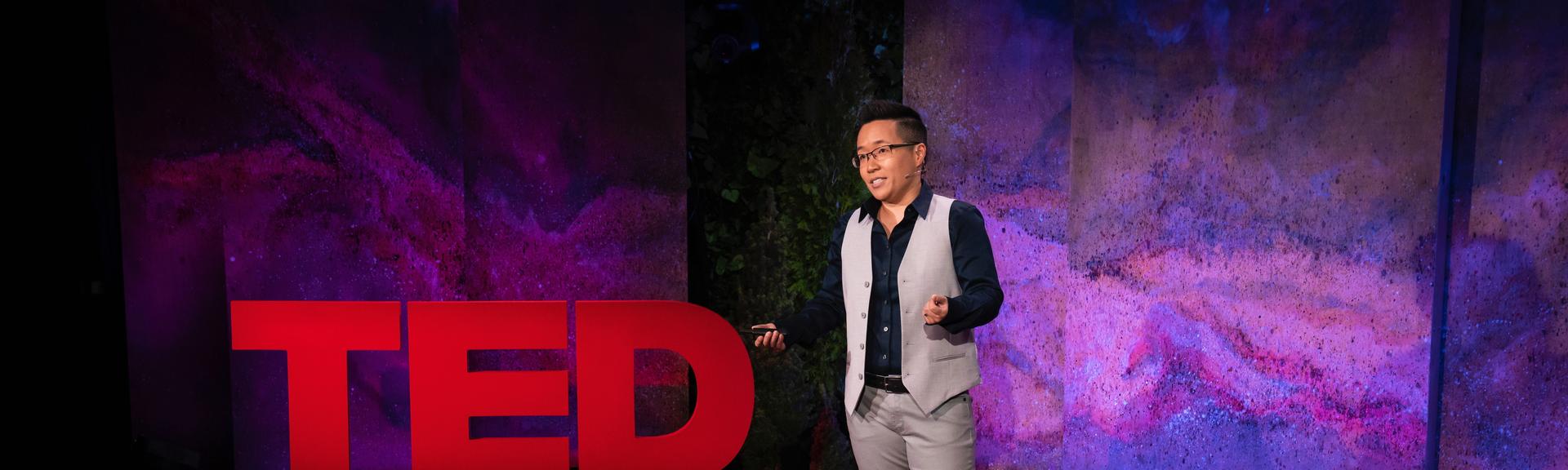 Jiaying Zhao giving a TED talk on the TED stage.