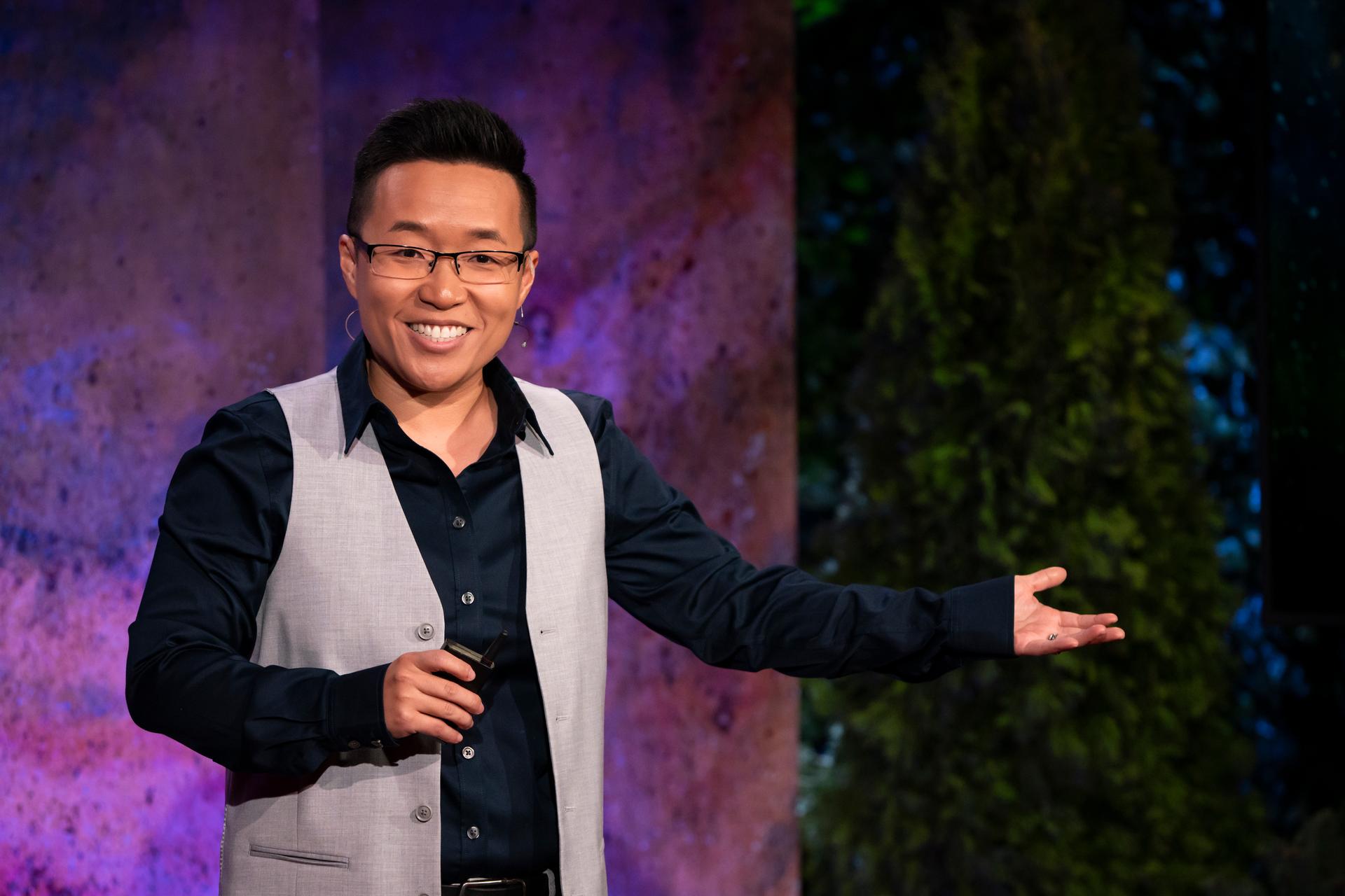 Jiaying Zhao gives a TED talk on the TED stage.