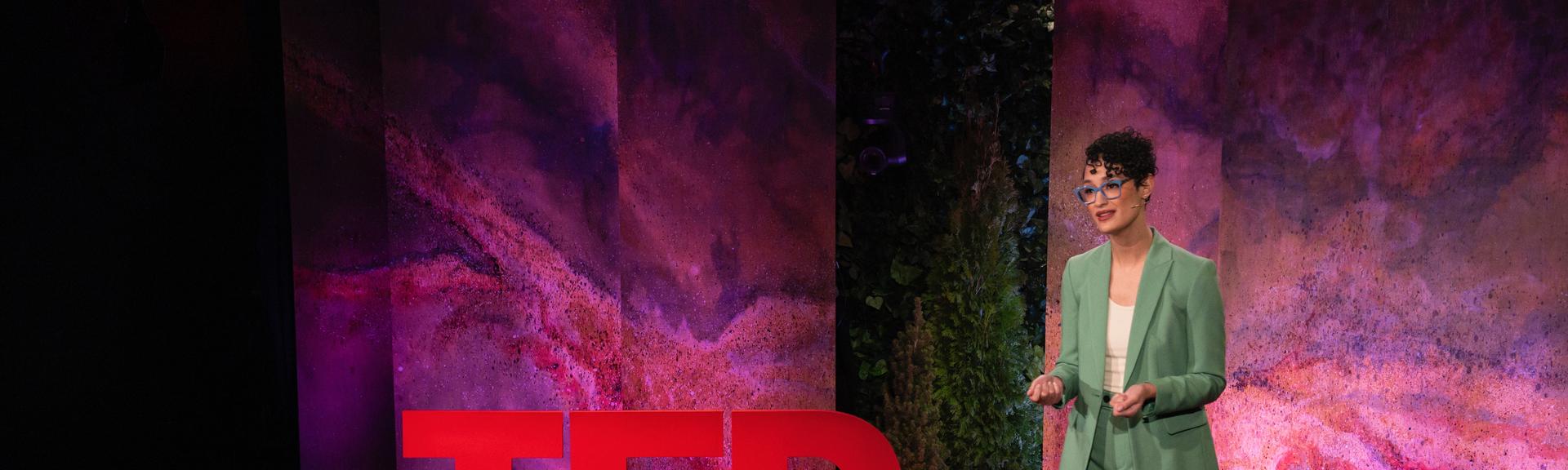 Rebecca Darwent gives a TED talk on the TED stage.