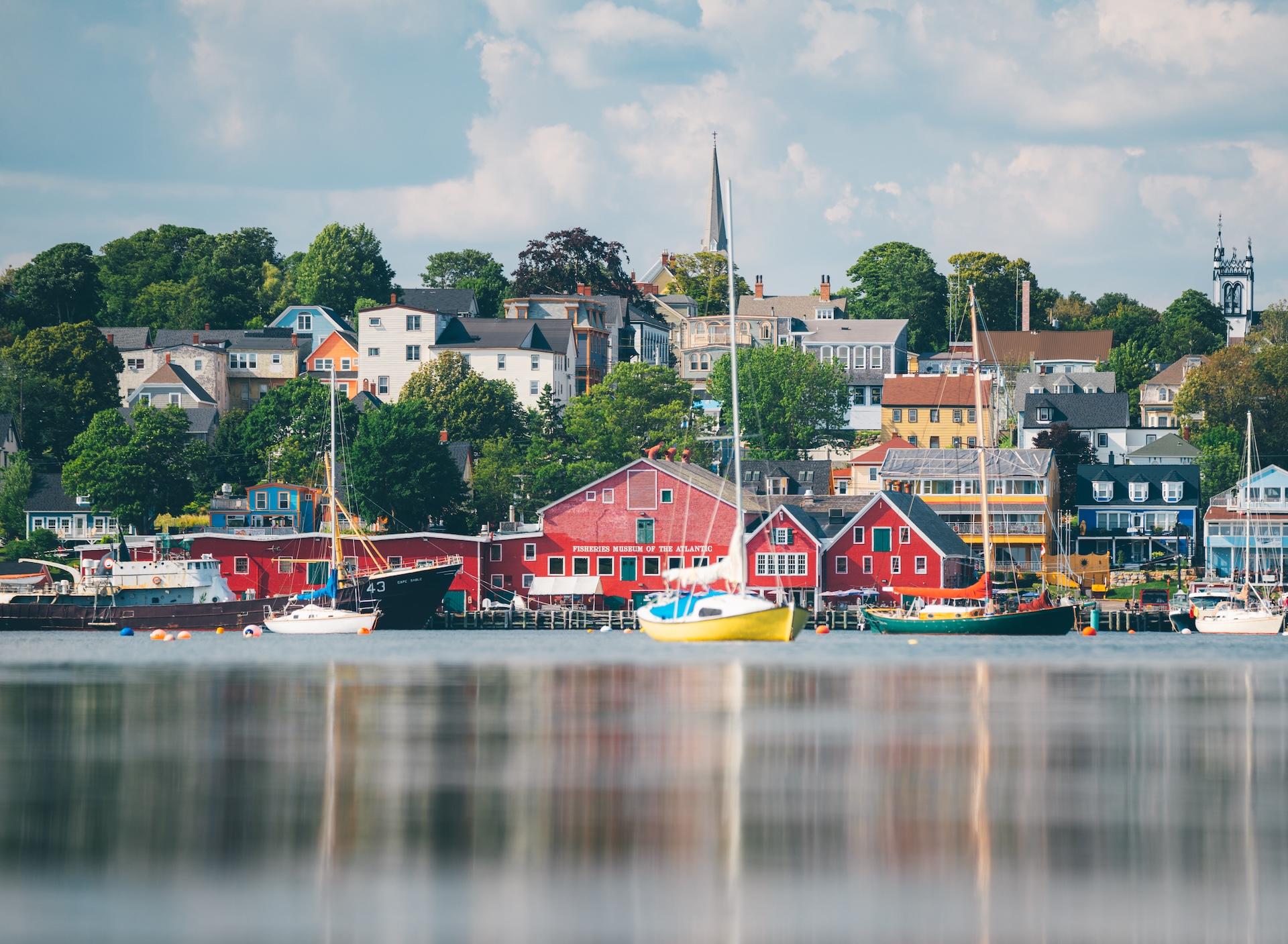 Boats docked by colorful buildings in Lunenburg, Nova Scotia